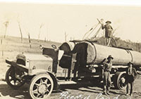 Historic photo - old truck towing logs