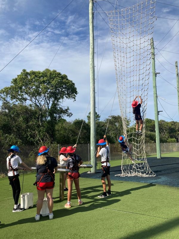 Students completing high ropes course.